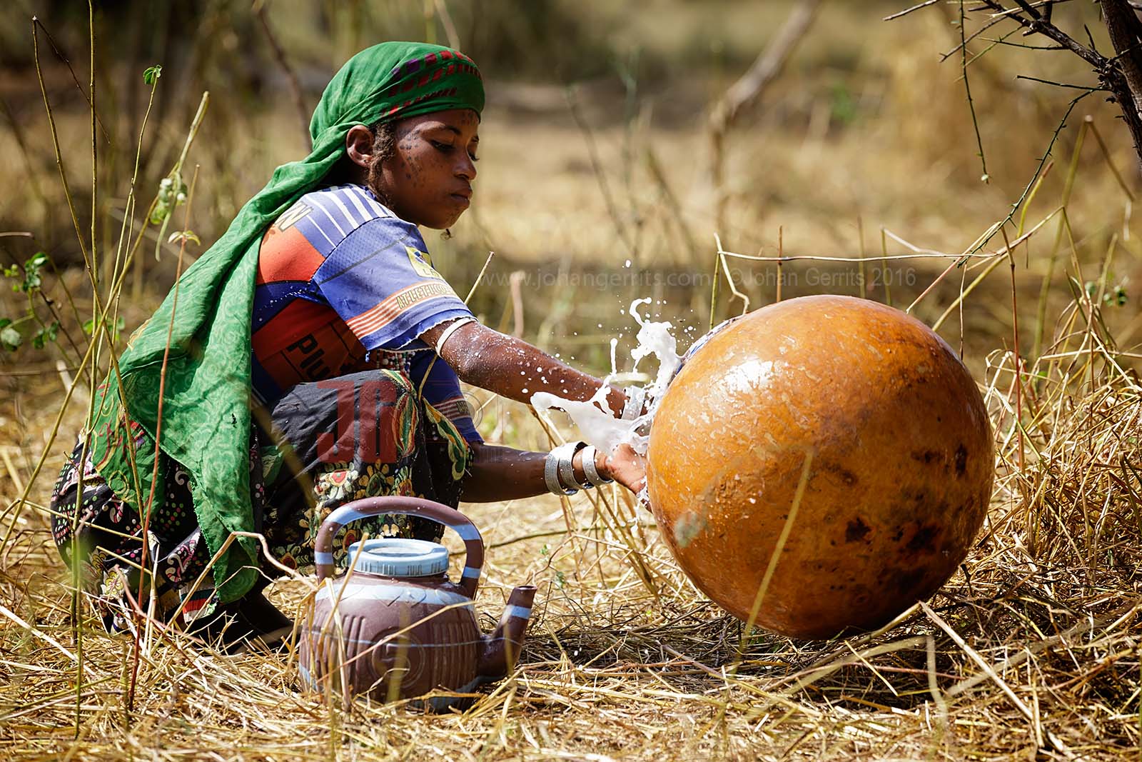 A young Bororo woman cleaning the milk basket